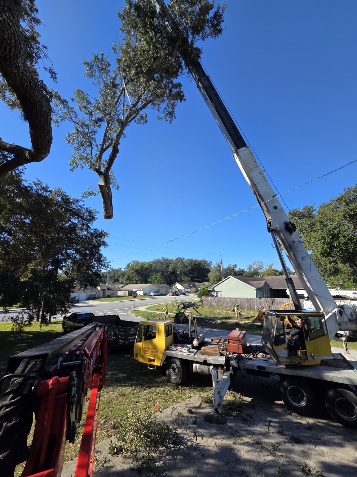 Crane-assisted removal at a Deltona home